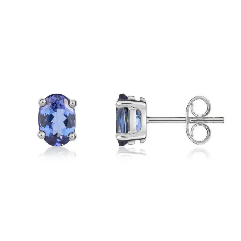 9ct White Gold Tanzanite 7x5mm Oval Claw Set Stud Earrings