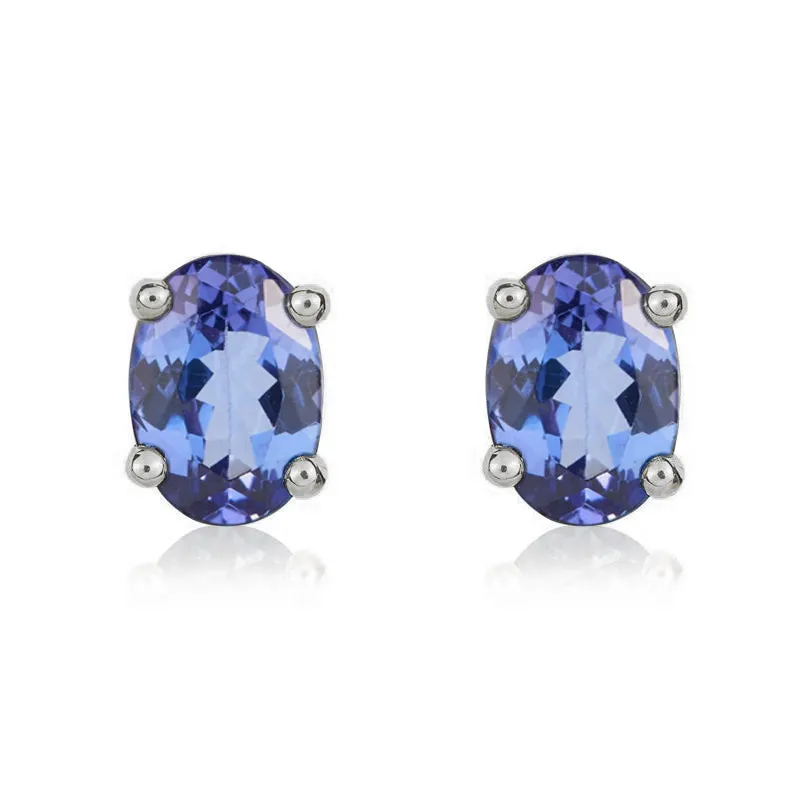 9ct White Gold Tanzanite 7x5mm Oval Claw Set Stud Earrings